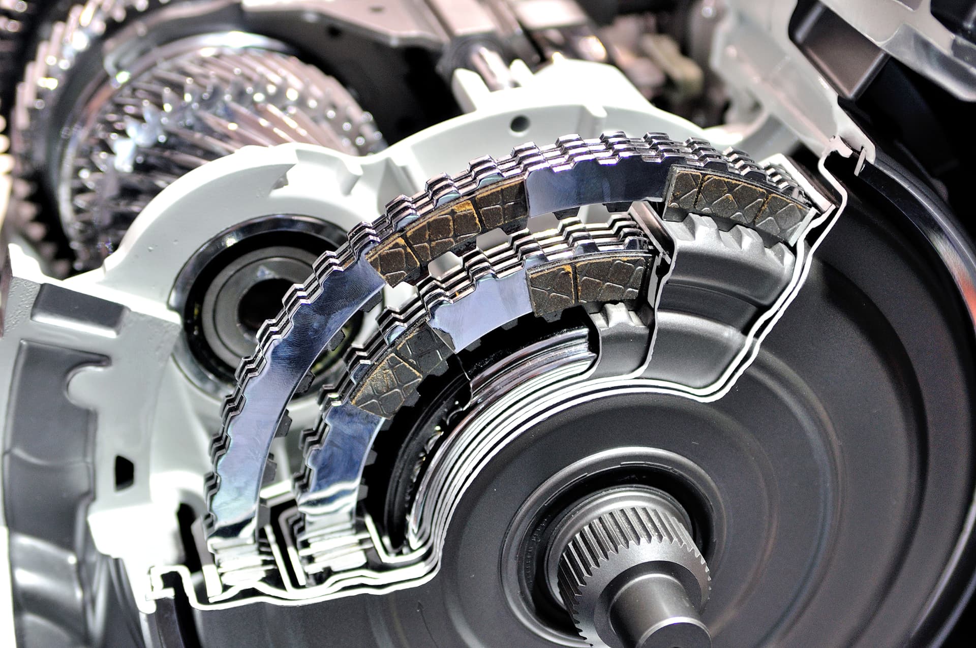 Cutaway view of an automatic transmission's clutch packs and gears during repair at Labor Only Auto Repair in Hutto, TX