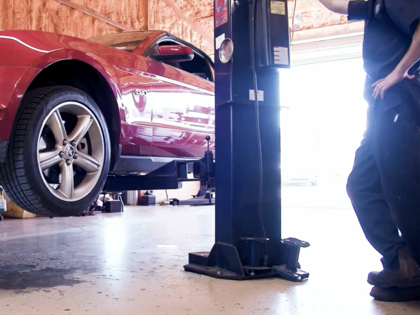 Top auto repair near me — Ford Mustang on lift at Labor Only Auto Repair in Hutto, TX