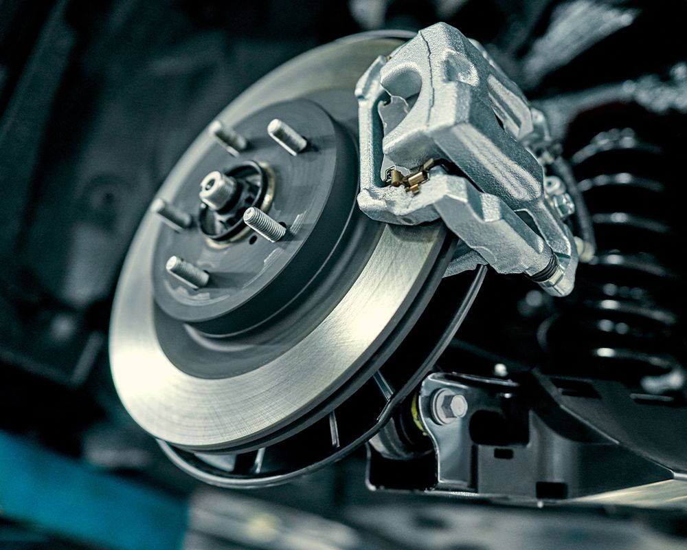 ASE Certified mechanic performing Brake Repair & Replacement